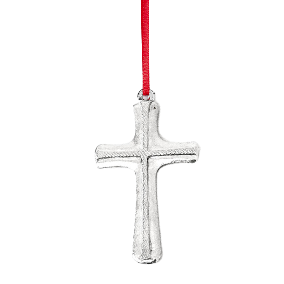Silver cross pendant on a red string against a white background