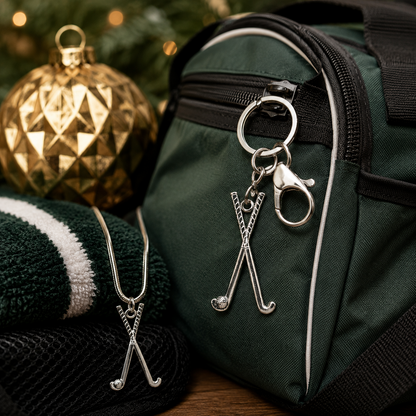 Green bag with hockey stick keychain and necklace, Christmas decorations in the background