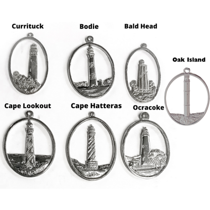 Set of silver pendants with lighthouse designs and labels on a white background