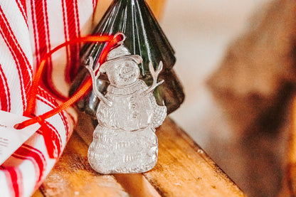 snowman with stick arms ornament